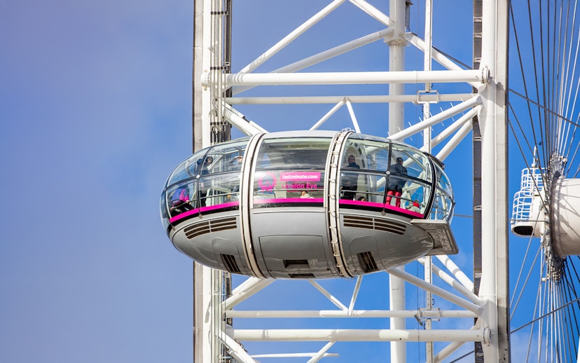 London Eye capsule with passengers enjoying views, part of Tower of London and London Eye combo tour.