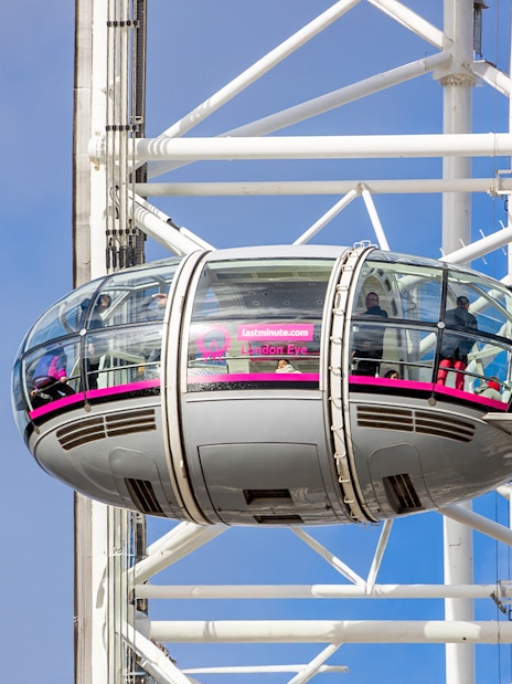 London Eye capsule with passengers enjoying views, part of Tower of London and London Eye combo tour.