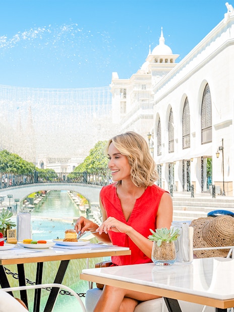 Lunch at The Land of Legends theme park with a view of fountains and architecture.