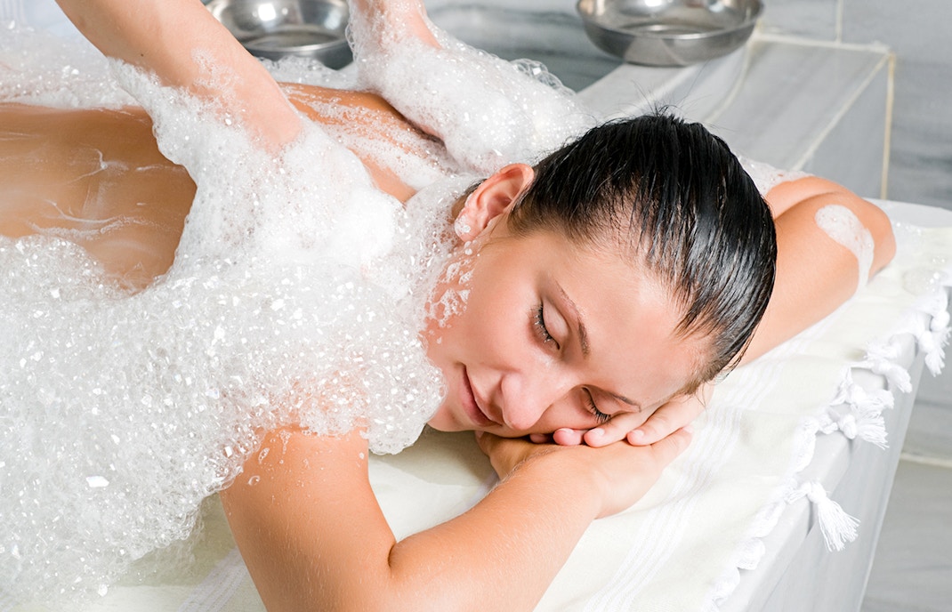 Traditional massage at Rudas thermal Turkish bath in Istanbul.