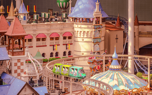 Indoor amusement park ride at Lotte World, Seoul, featuring a colorful monorail and castle-themed decor.