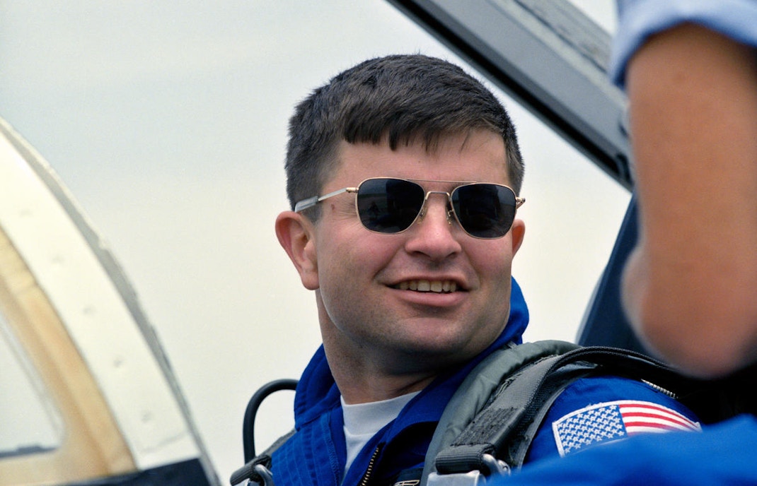 Astronaut in cockpit at Kennedy Space Center.