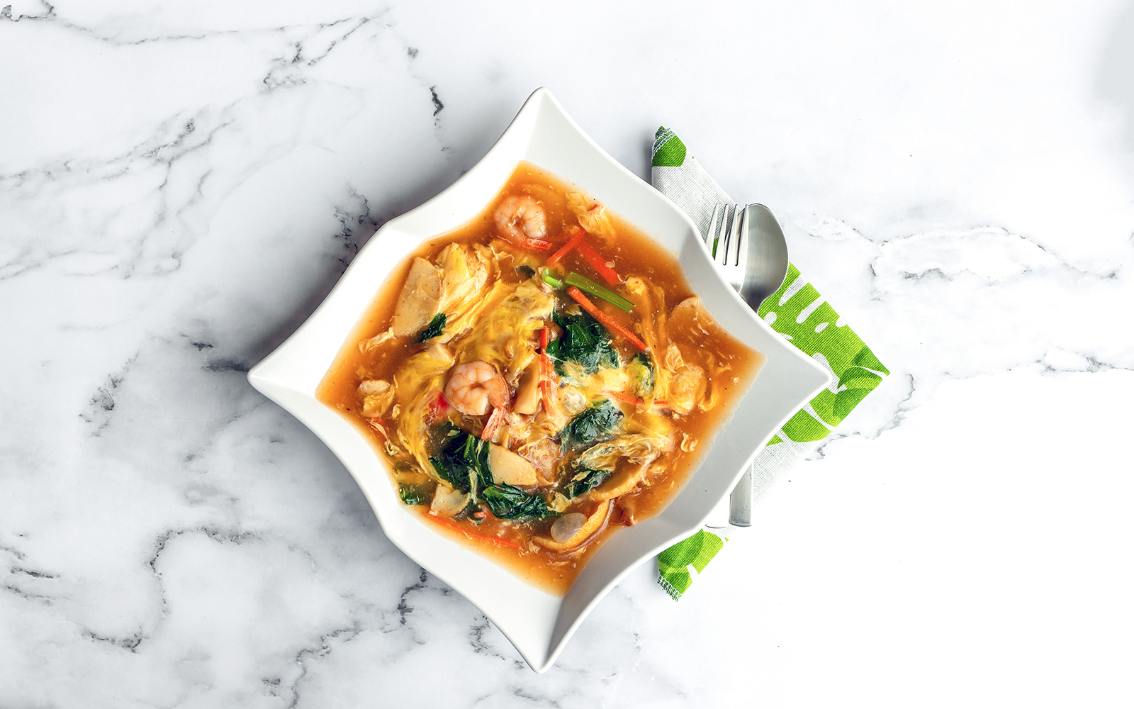 Wat Tan Hor, Cantonese noodles with prawns and vegetables in a savory sauce.