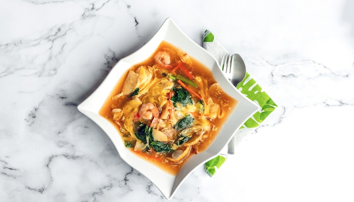 Wat Tan Hor, Cantonese noodles with prawns and vegetables in a savory sauce.