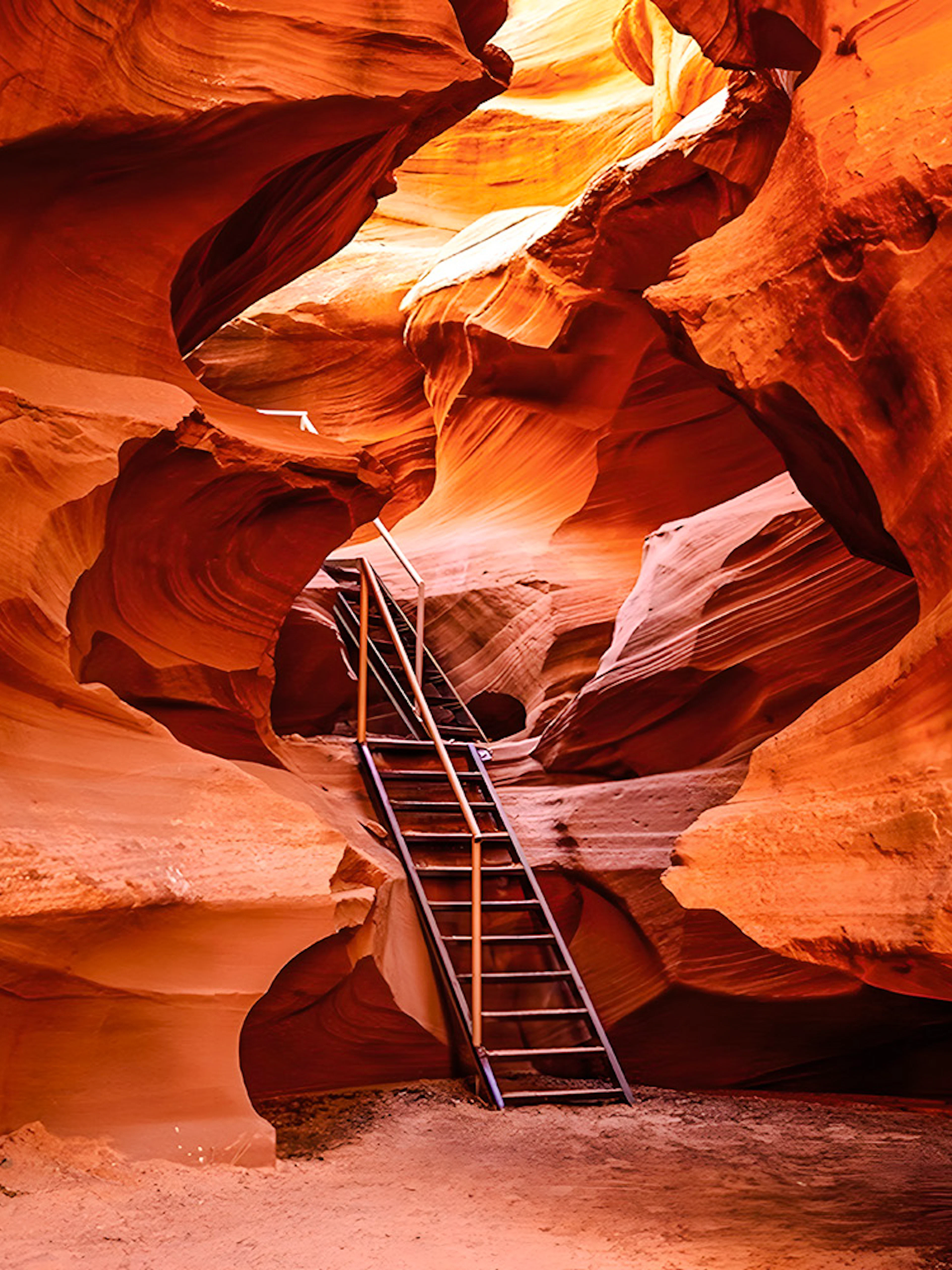 Ladder leading through narrow sandstone formations in Waterhole Canyon.