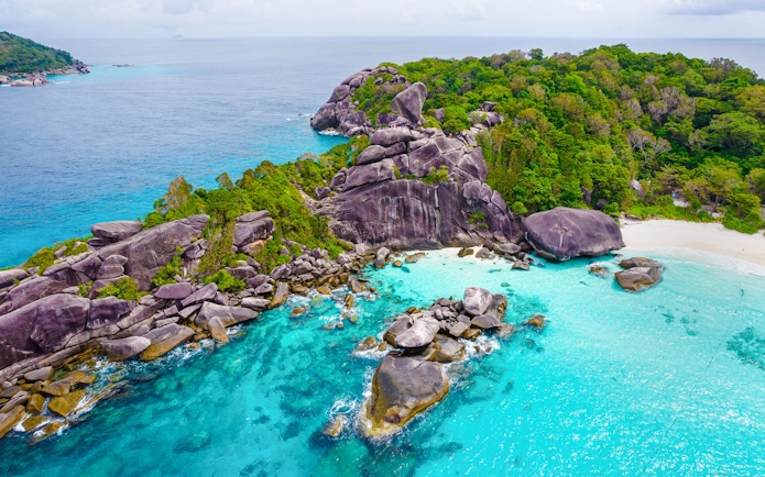 Aerial view of Similan Island's rocky coastline and turquoise waters.