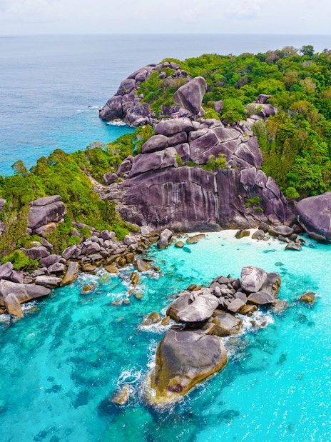 Aerial view of Similan Island's rocky coastline and turquoise waters.