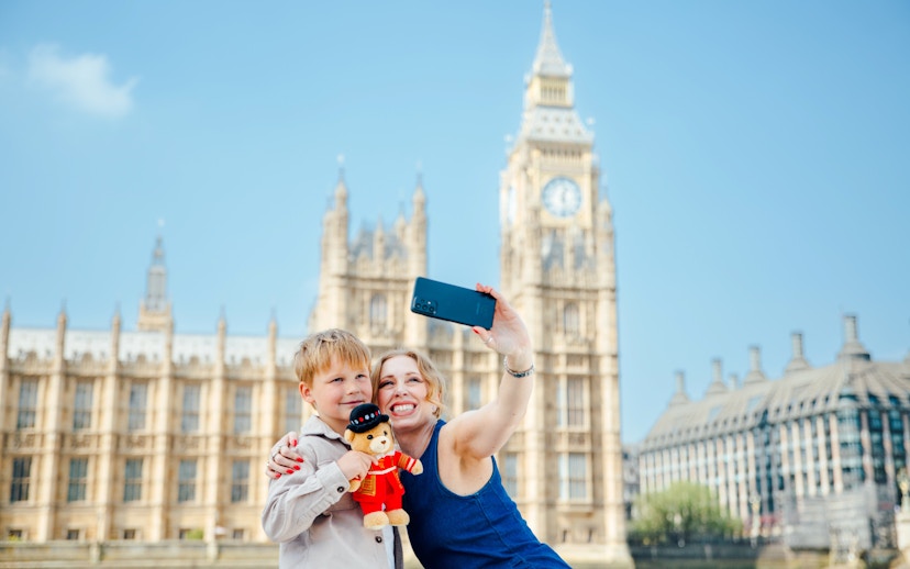 Guests taking a selfie with Big Ben in the background on the Tower of London Cruise.