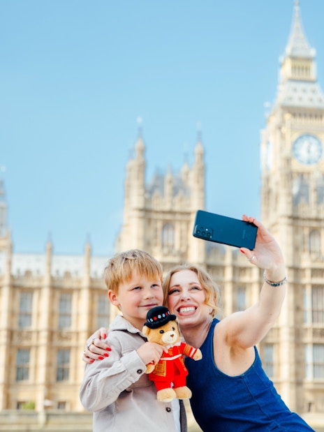 Guests taking a selfie with Big Ben in the background on the Tower of London Cruise.