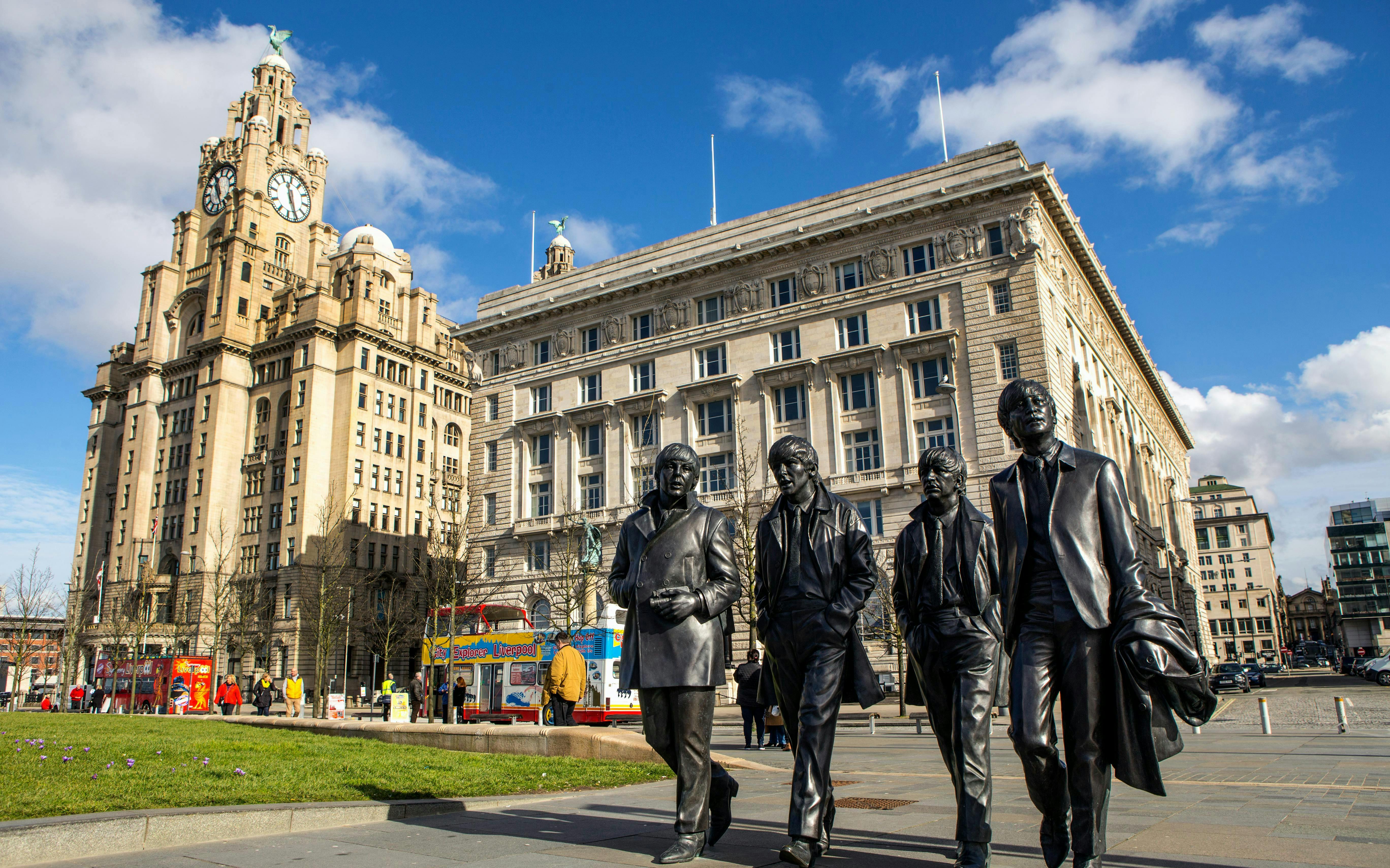 Statues of musicians near the Royal Liver Building in Liverpool.