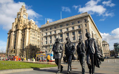 Statues of musicians near the Royal Liver Building in Liverpool.
