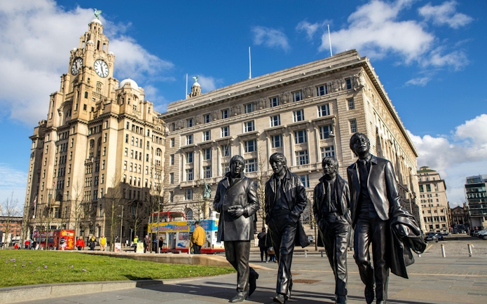 Statues of musicians near the Royal Liver Building in Liverpool.
