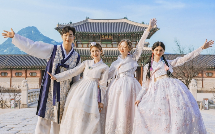 Visitors in traditional hanbok at Gyeongbokgung Palace, Seoul.