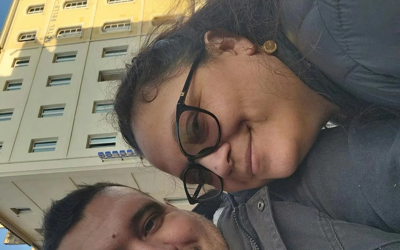 Couple in front of Hotel Belle Vue, Marseille, during a self-guided city exploration game.