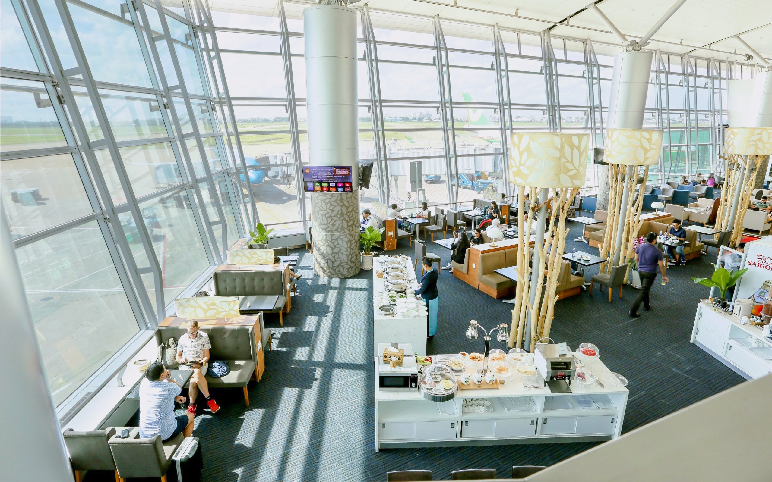 Rose Business Lounge seating and buffet area, Terminal 2, Tan Son Nhat International Airport.