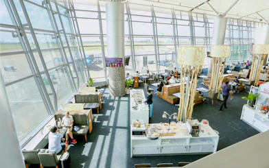 Rose Business Lounge seating and buffet area, Terminal 2, Tan Son Nhat International Airport.