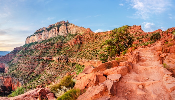South Kaibab Trail at sunrise, Grand Canyon National Park, showcasing early morning light on canyon ridges.