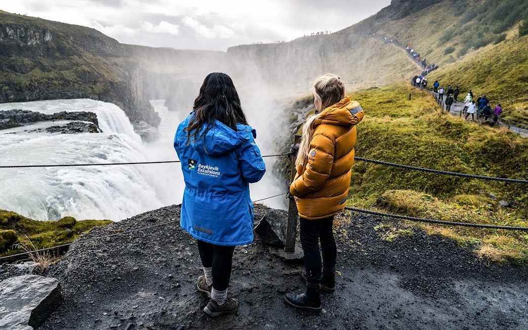 Tourists viewing Gullfoss Falls on Golden Circle day trip, Iceland.