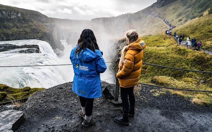Tourists viewing Gullfoss Falls on Golden Circle day trip, Iceland.