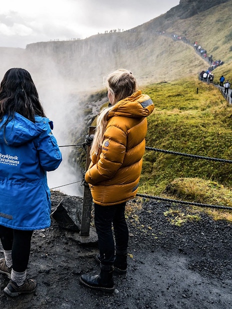 Tourists viewing Gullfoss Falls on Golden Circle day trip, Iceland.
