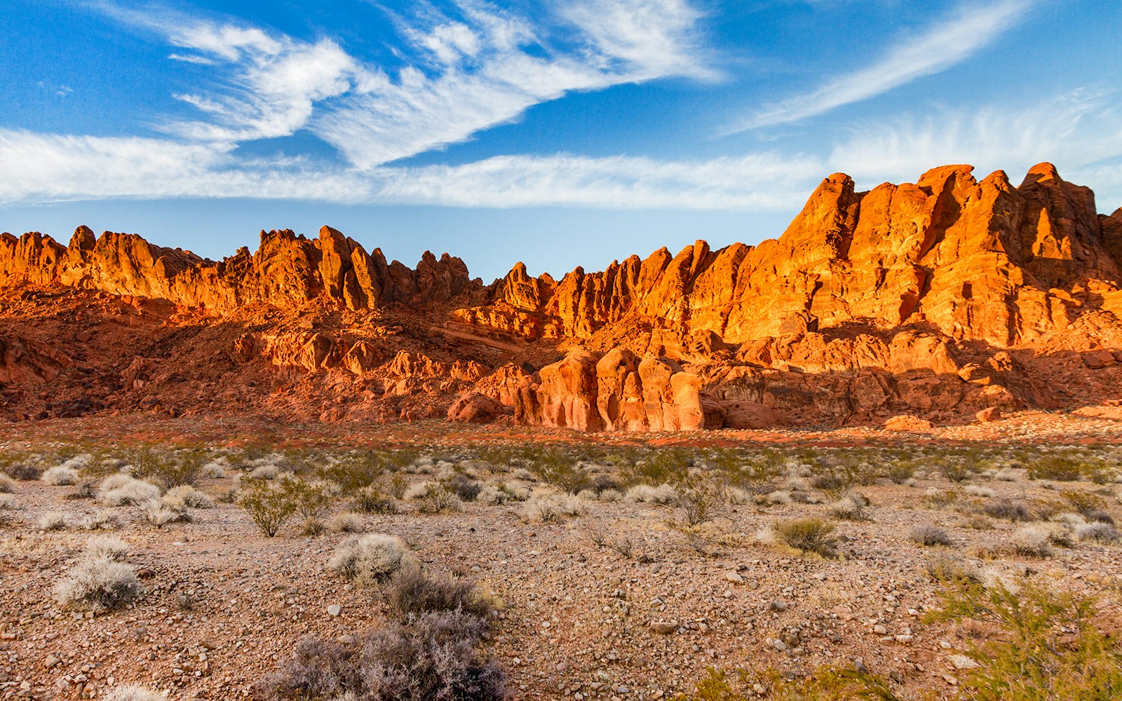 Scenic view of the sun setting over the vibrant landscape of Mesquite, Nevada, highlighting the unique desert beauty of this popular tourist destination