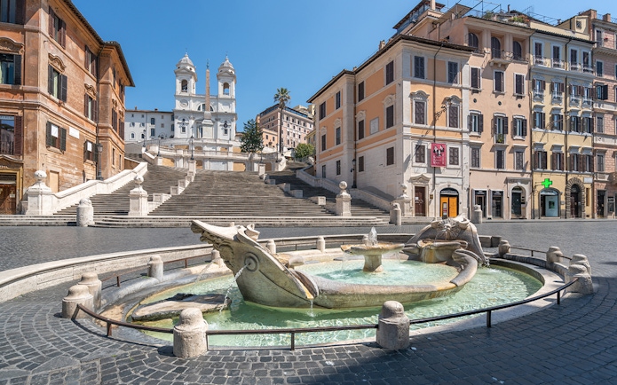 Spanish Steps in Rome with Barcaccia Fountain in foreground.