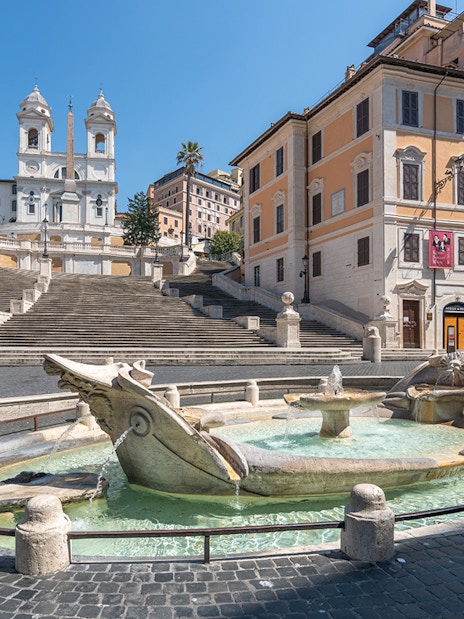 Spanish Steps in Rome with Barcaccia Fountain in foreground.