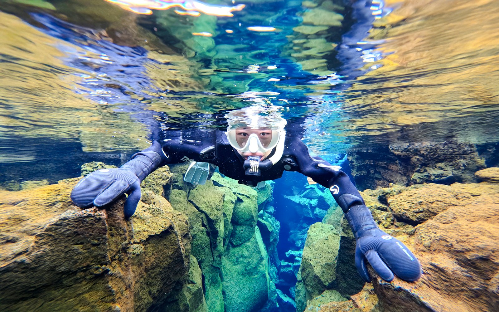 Pose for underwater photos clicked by your guide