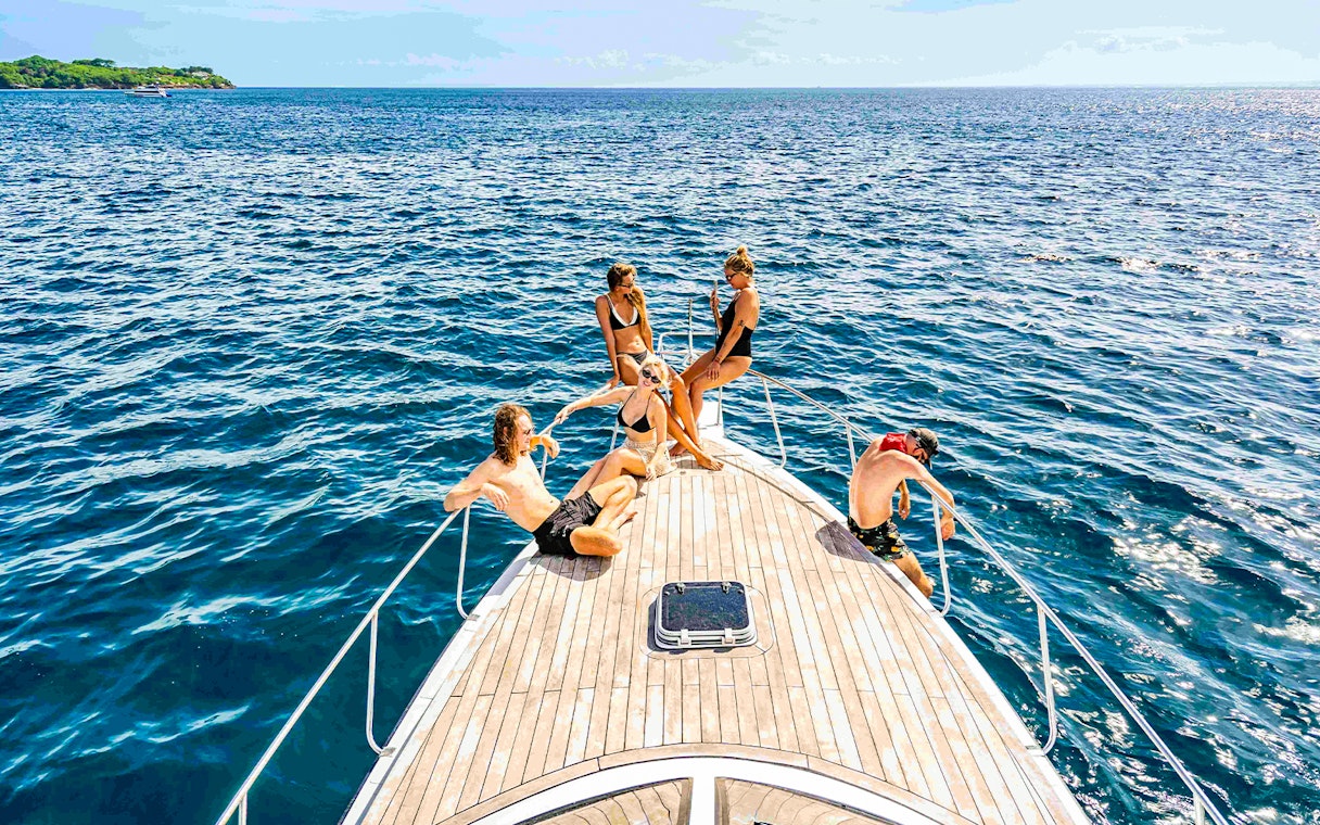 Participants relaxing on a boat during Nusa Penida & Manta Point snorkelling tour in Bali.
