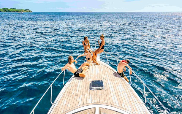 Participants relaxing on a boat during Nusa Penida & Manta Point snorkelling tour in Bali.