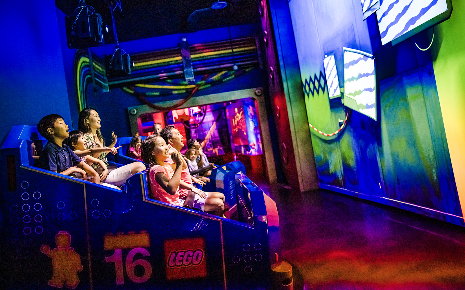 Guests enjoying a ride at Legoland New York indoor attraction.