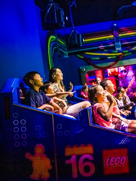 Guests enjoying a ride at Legoland New York indoor attraction.