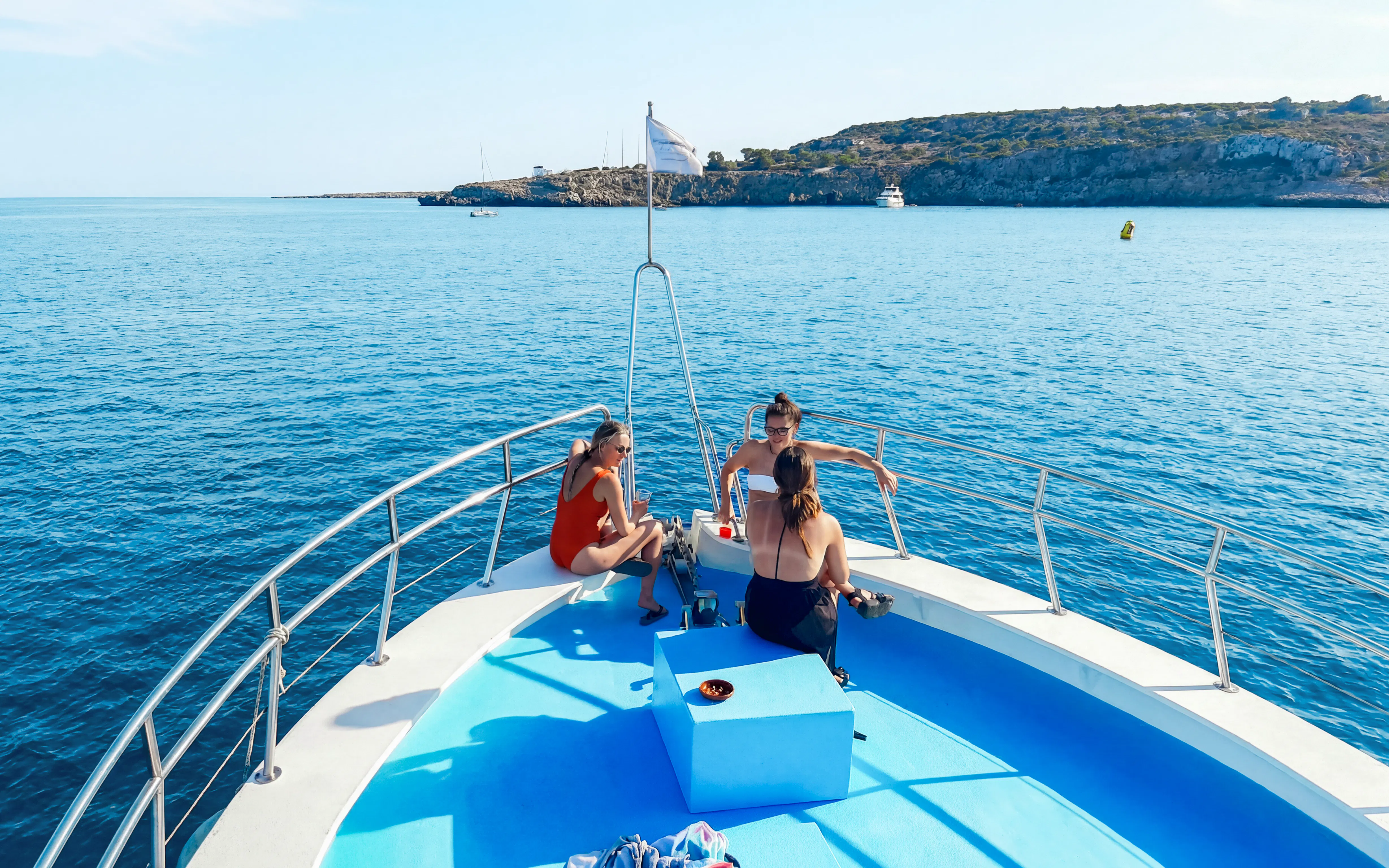 Boat deck with people relaxing, enjoying the Blue Lagoon cruise near Protaras, Cyprus.