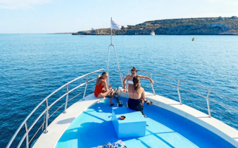 Boat deck with people relaxing, enjoying the Blue Lagoon cruise near Protaras, Cyprus.