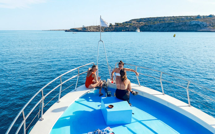 Boat deck with people relaxing, enjoying the Blue Lagoon cruise near Protaras, Cyprus.