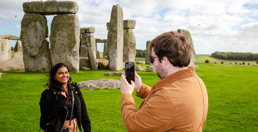 Visitors taking photos at Stonehenge, England.