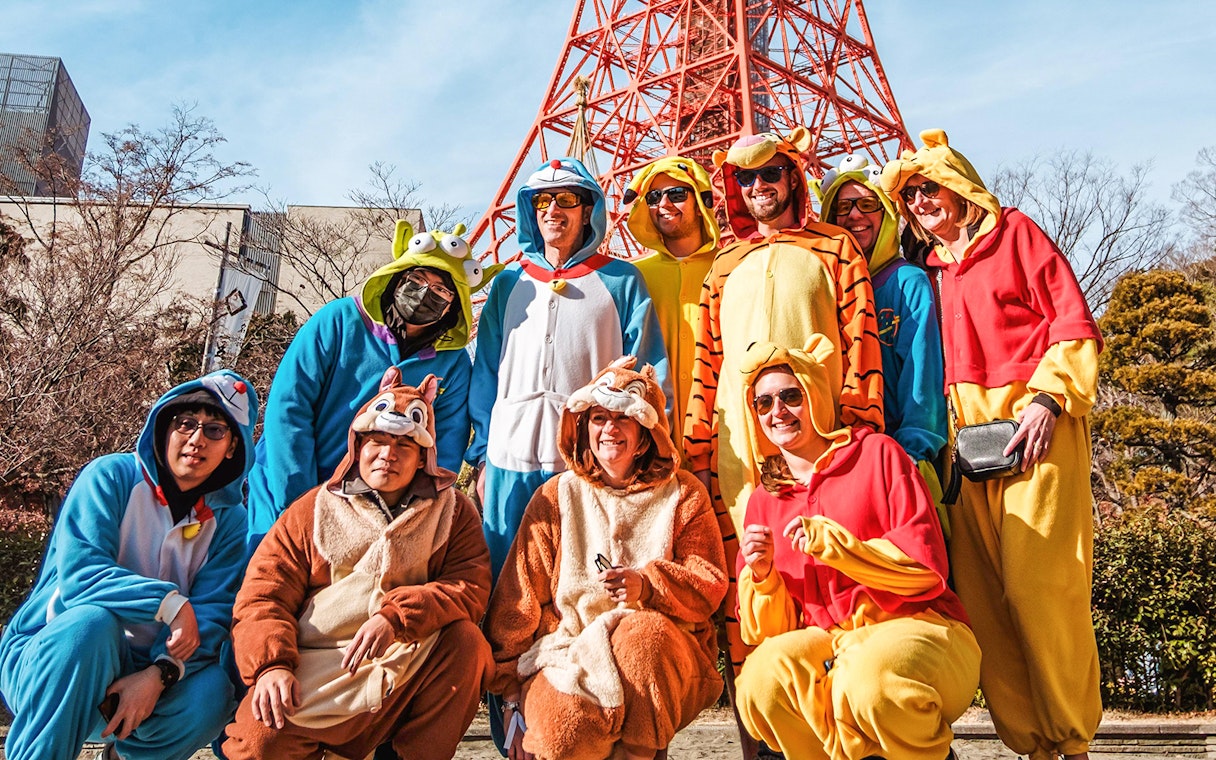 Group in costumes posing on Tokyo Shibuya Street for Go-Kart Experience.