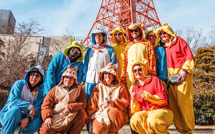 Group in costumes posing on Tokyo Shibuya Street for Go-Kart Experience.
