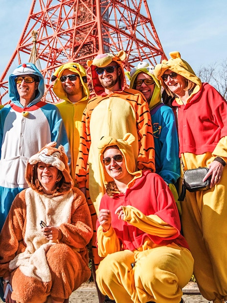 Group in costumes posing on Tokyo Shibuya Street for Go-Kart Experience.