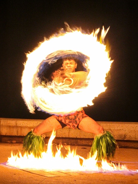 Fire dancer performing at Moana Luau, Hawaii.