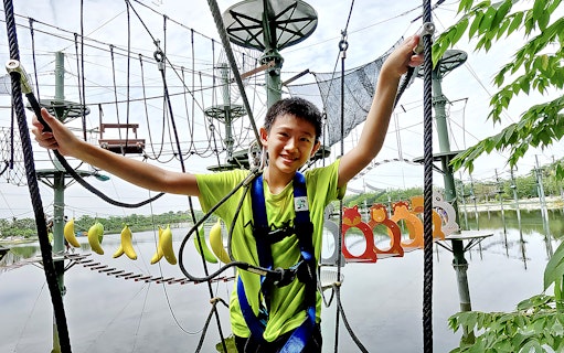 Child navigating ropes course at ESCAPE Ipoh Theme Park, Malaysia.