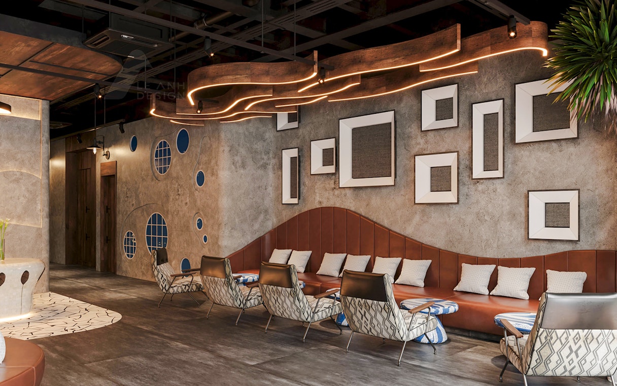 Seating area with leather sofas and patterned chairs, textured wall with frames.