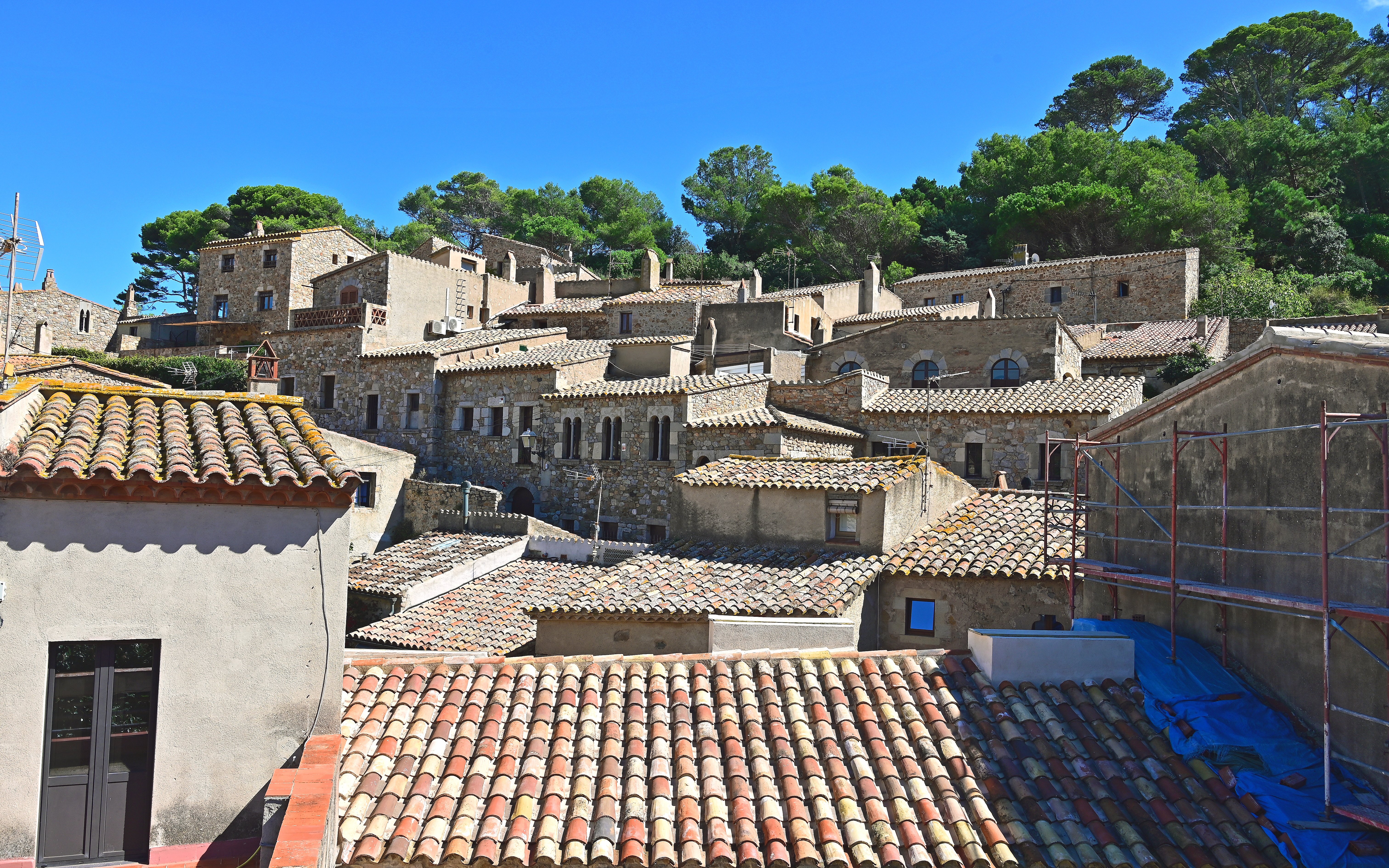 Roofs and stone houses in the old town of Tossa de Mar, Costa Brava, Spain.