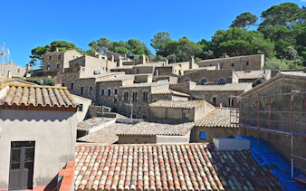 Roofs and stone houses in the old town of Tossa de Mar, Costa Brava, Spain.