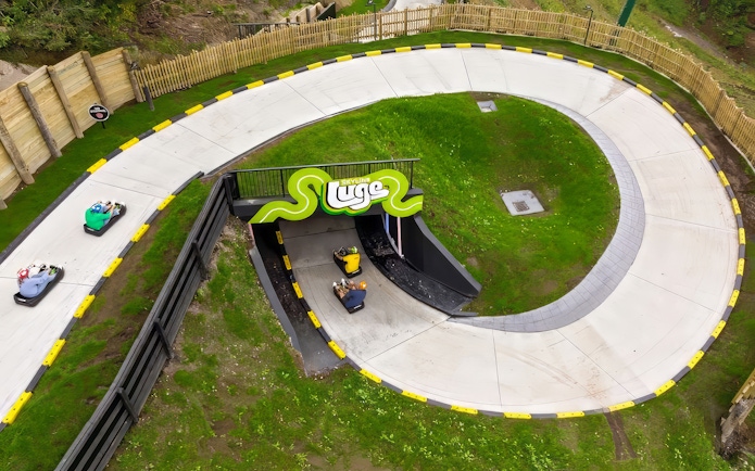 Aerial view of luge track with riders at Skyline Luge, Kuala Lumpur.