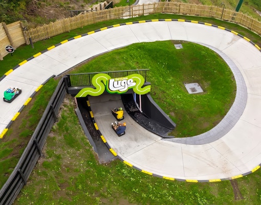 Aerial view of The Skyline Luge track winding through lush greenery