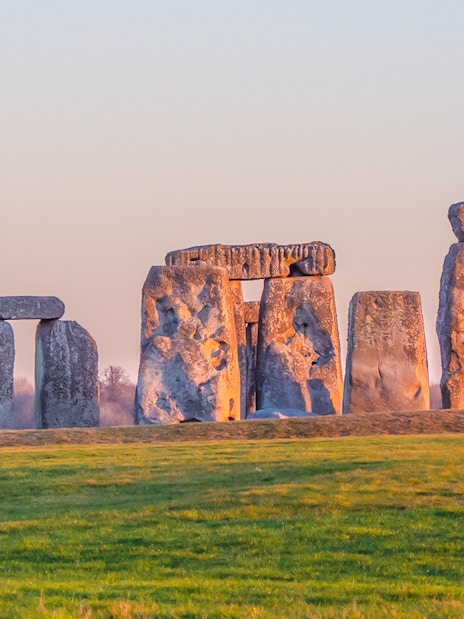 Stonehenge stone circle at sunset in Wiltshire, England.