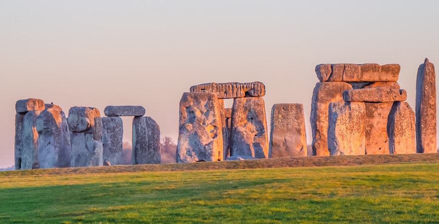 Stonehenge stone circle at sunset in Wiltshire, England.