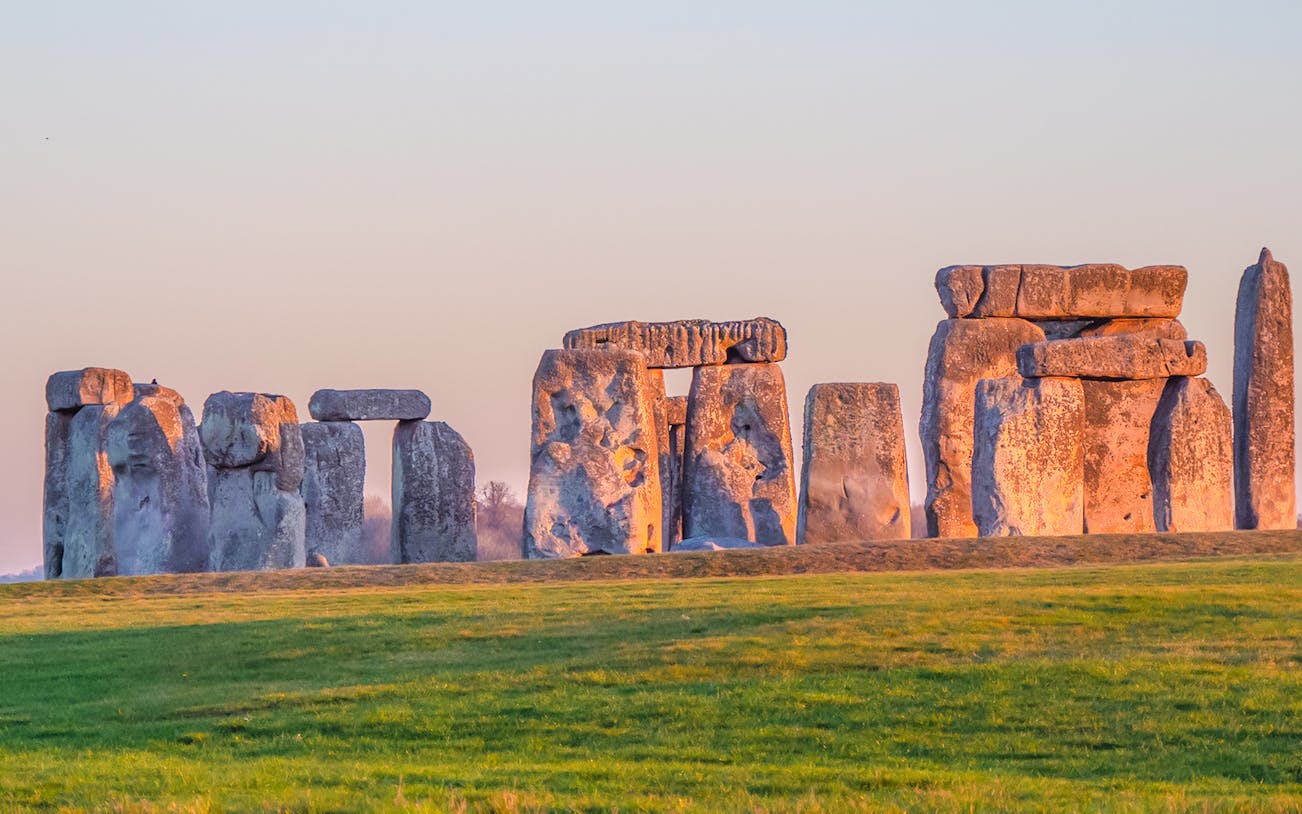 Stonehenge stone circle at sunset in Wiltshire, England.