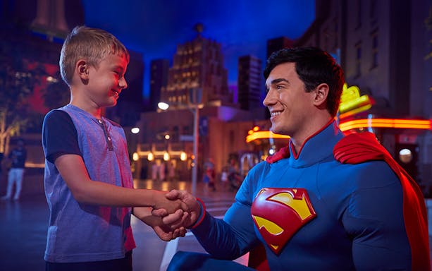 Child meeting superhero at Warner Bros. World Abu Dhabi.
